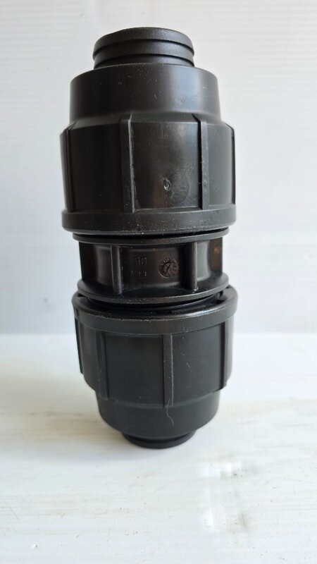 A poly pipe straight coupling.