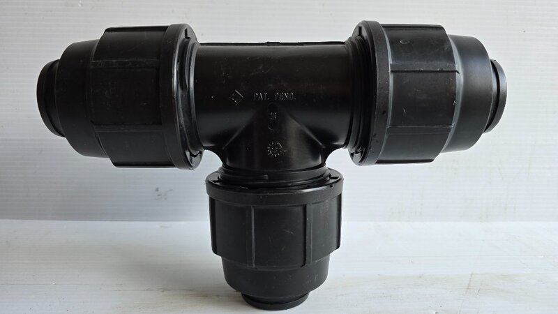 A poly pipe tee fitting.